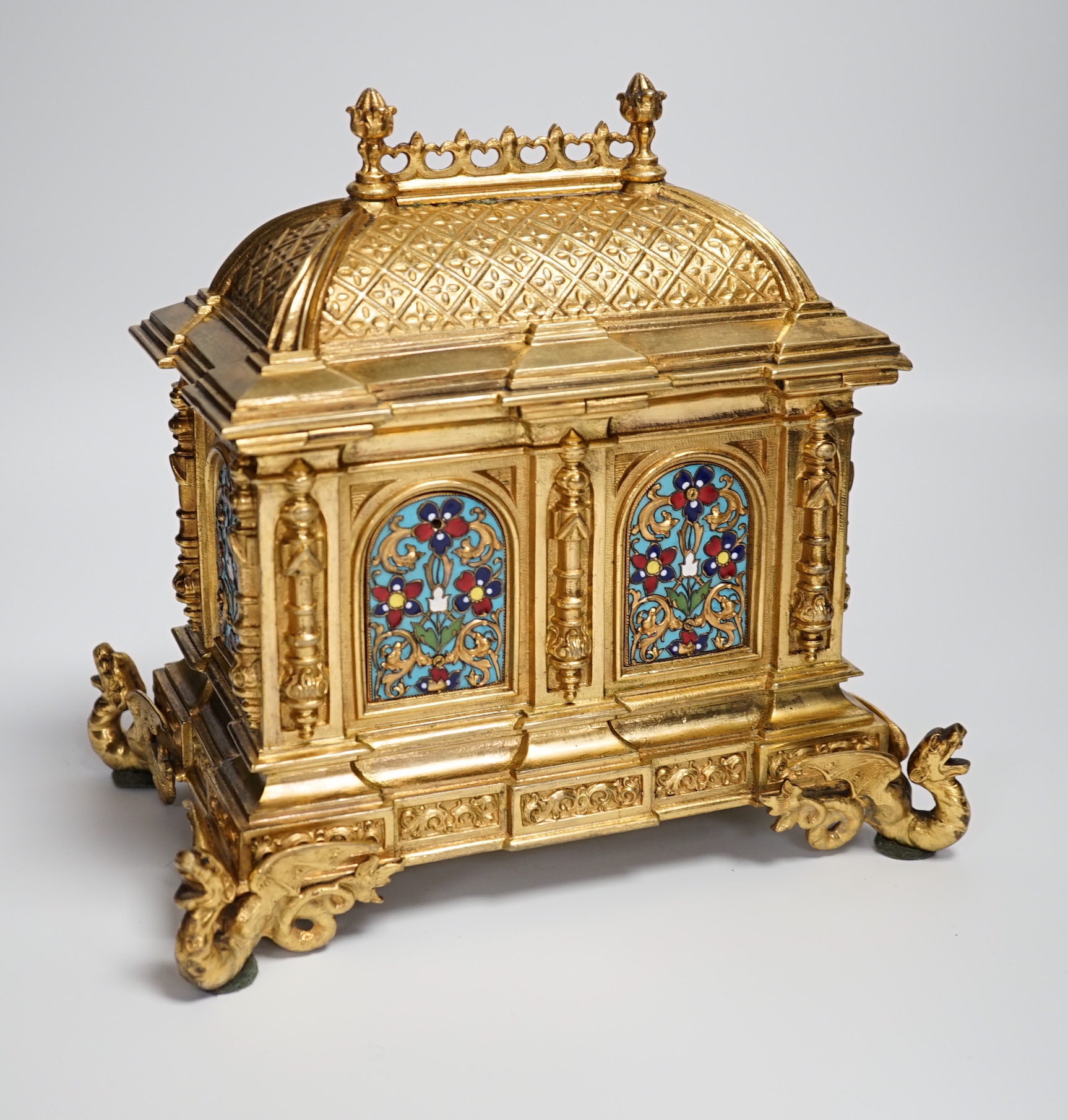 A cast brass and enamel casket 22cm high x 22cm wide